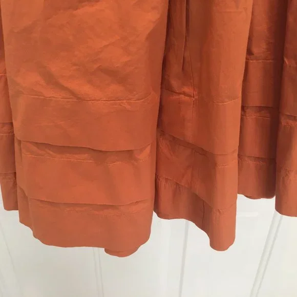 Ulla Johnson orange high neck with ties belted waist 3 layers of ruffles at hem